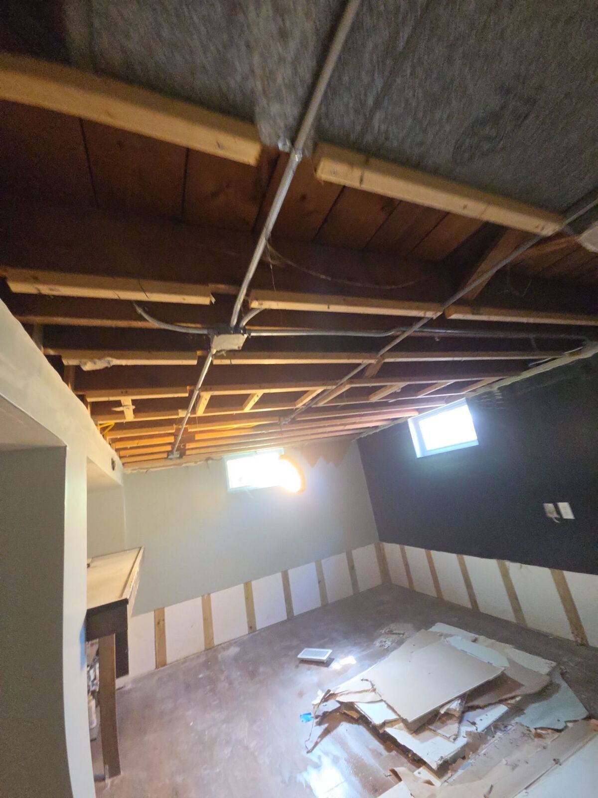 Basement with the ceiling and lower walls removed during demolition after a loss